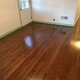 The original hardwood floors were refinished with new stain and poly.